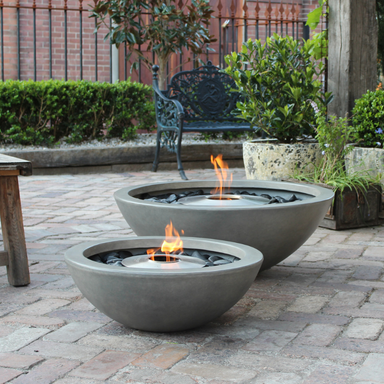 Two EcoSmart Mix Fire Pits in an outdoor courtyard, Mix 850 paired with a smaller Mix 600.