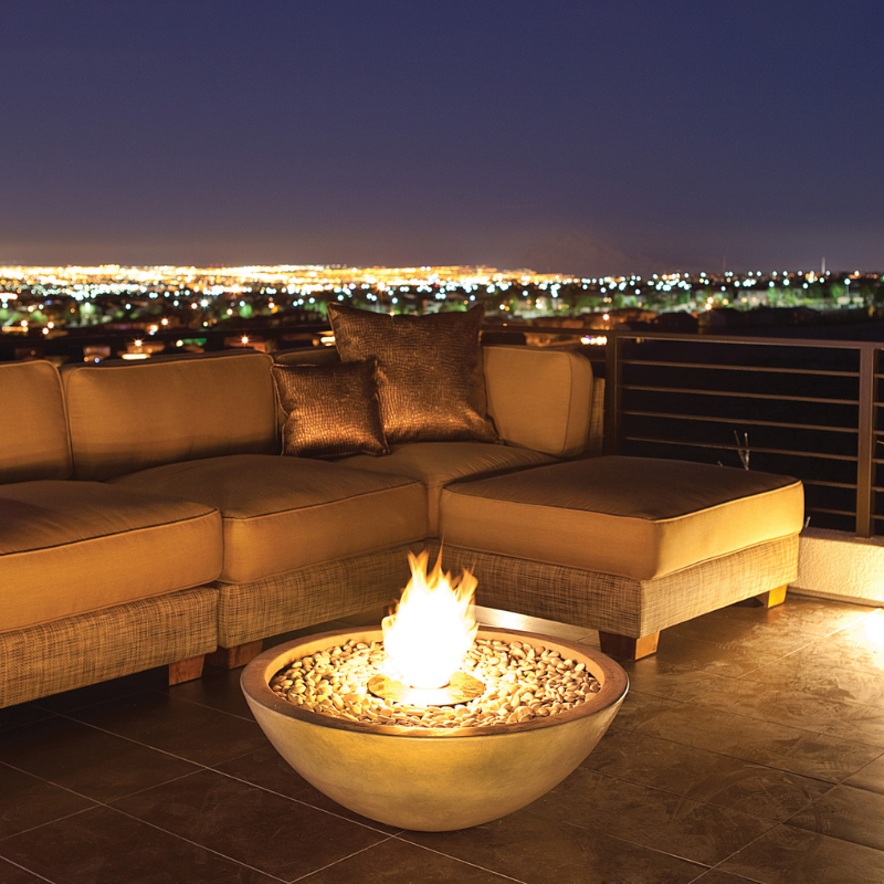 EcoSmart Mix 850 Fire Pit on a rooftop lounge at night with city lights and sectional seating.