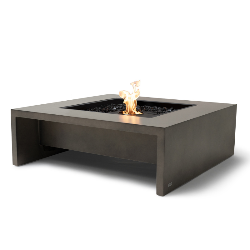 EcoSmart Mojito 40 Fire Table in Natural Fluid concrete with Black surround, angle view showing waterfall edge.