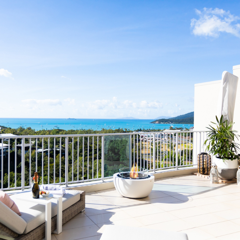 EcoSmart Pod 30 Fire Pit on a balcony terrace with sea view.