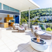 EcoSmart Pod 30 Fire Pit on a luxury balcony terrace with ocean view.