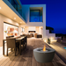 EcoSmart Pod 40 Fire Pit on a luxury outdoor deck at night.