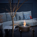 EcoSmart Round 20 Fire Pit Kit integrated into a modern patio design, enhancing the ambiance with its central flame and minimalist aesthetic.