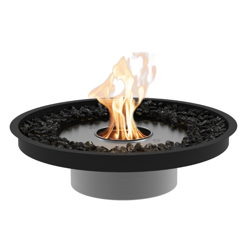 EcoSmart Round 20 Fire Pit Kit featuring a round stainless steel burner surrounded by black stones, providing a sleek and modern flame.