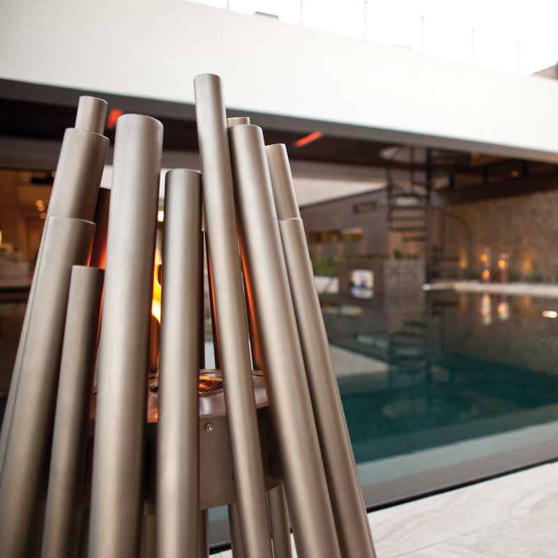 EcoSmart Stix Fire Pit closeup showing stainless steel tubular frame and burner detail