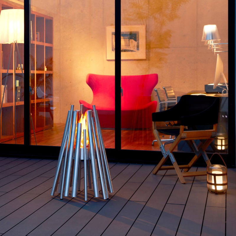 EcoSmart Stix Fire Pit balcony closeup with warm flame outside apartment style living space