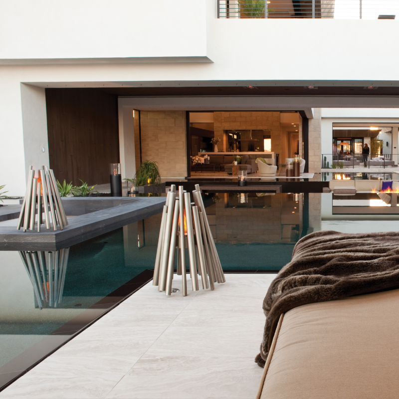 EcoSmart Stix Fire Pit reviews image in upscale poolside patio lounge area