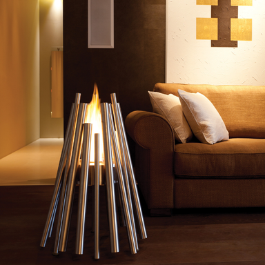 EcoSmart Stix Fire Pit styled as a safe indoor fire pit beside lounge sofa with modern smokeless flame
