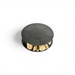 Top-down studio view of the Fabrizio Fire Pit showing its circular black steel top and integrated firewood storage compartment below, presented against a plain background for product detail