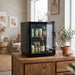 Husky 48L mini glass door bar fridge on a sideboard in an entertaining nook stocked with drinks