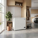 Husky white chest fridge and freezer in a modern Australian home garage and mudroom with timber storage and polished concrete floor