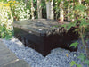 BioSmart filter buried to a third of its height beside a garden deck