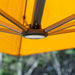 Shadowspec LED light illuminated at the hub of an umbrella canopy