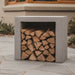 Ochre Living Side Log Store Ossa positioned in a modern outdoor garden area with neatly stacked firewood inside, highlighting its clean rectangular form and outdoor fireplace compatibility