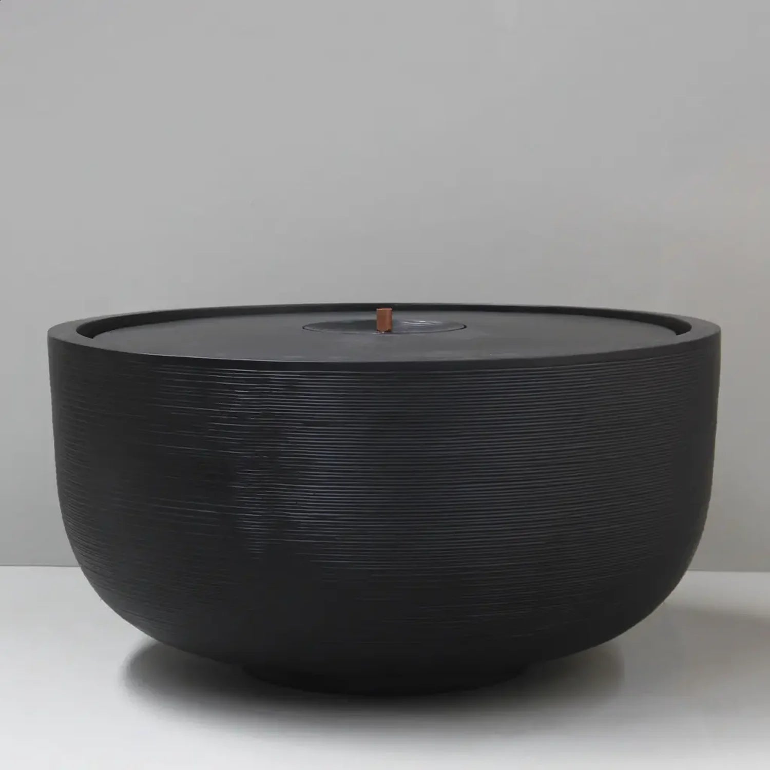 Pietro Stoneware Cascade Bubbler Fountain in black, studio shot