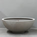 Pietro Stoneware Volcano Bowl Bubbler Fountain in natural cement, studio shot