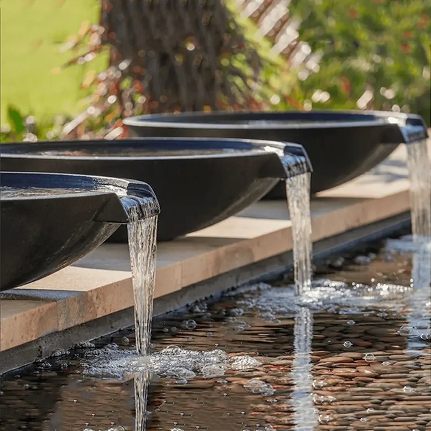 Pietro Stoneware Wok Spillway Bowl, black, three bowls pouring into a pool