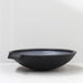 Pietro Stoneware Wok Spillway Bowl in black, studio shot