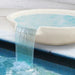 Pietro Stoneware Wok Spillway Bowl, matte white, pouring into a pool
