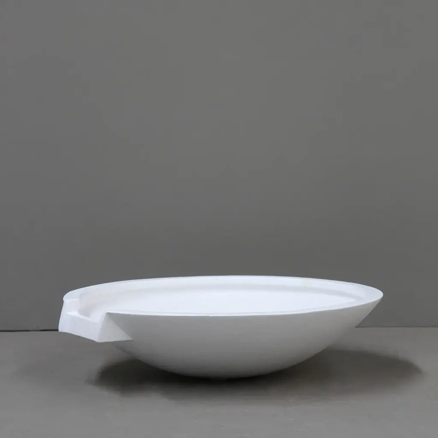 Pietro Stoneware Wok Spillway Bowl in matte white, studio shot