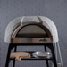 Close front angle of the Polito Antonius Garden Wood Fired Oven showing the textured dome finish, stainless steel oven opening, pizza peels, and serving tray on the integrated stand