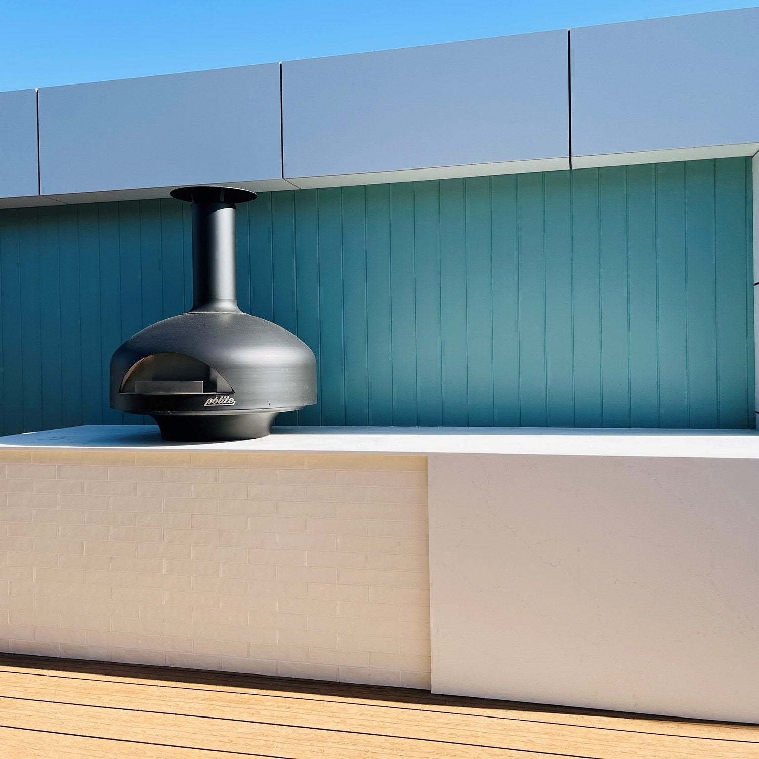 Polito Giotto in Charcoal on a bench in a modern outdoor kitchen