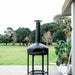 Polito Giotto in Black on the Hexa stand on a deck overlooking a lawn