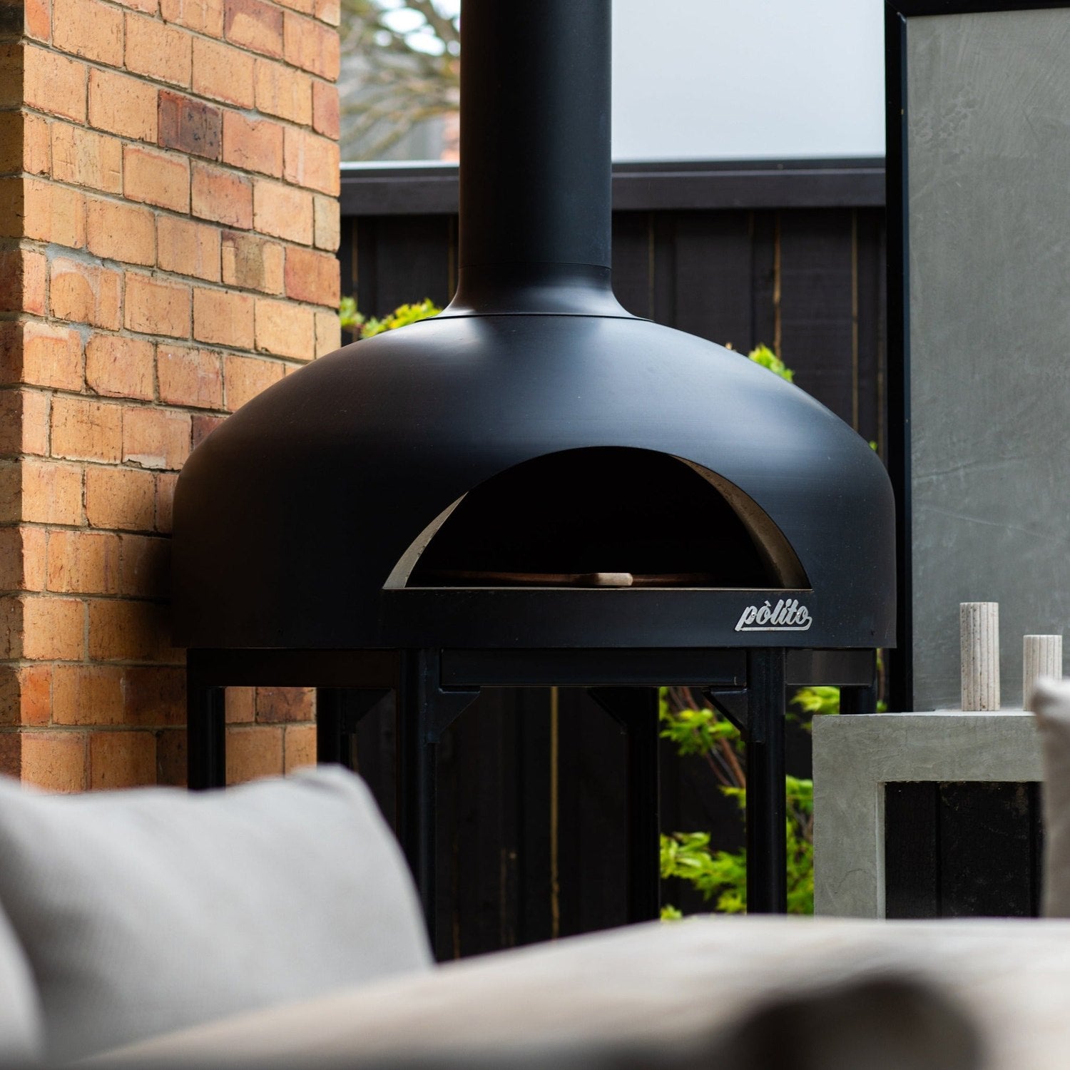 Polito Giotto wood fire pizza oven in black finish — on stand outdoor — My Acre