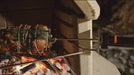 Buschbeck rotisserie turning a roast over the fire