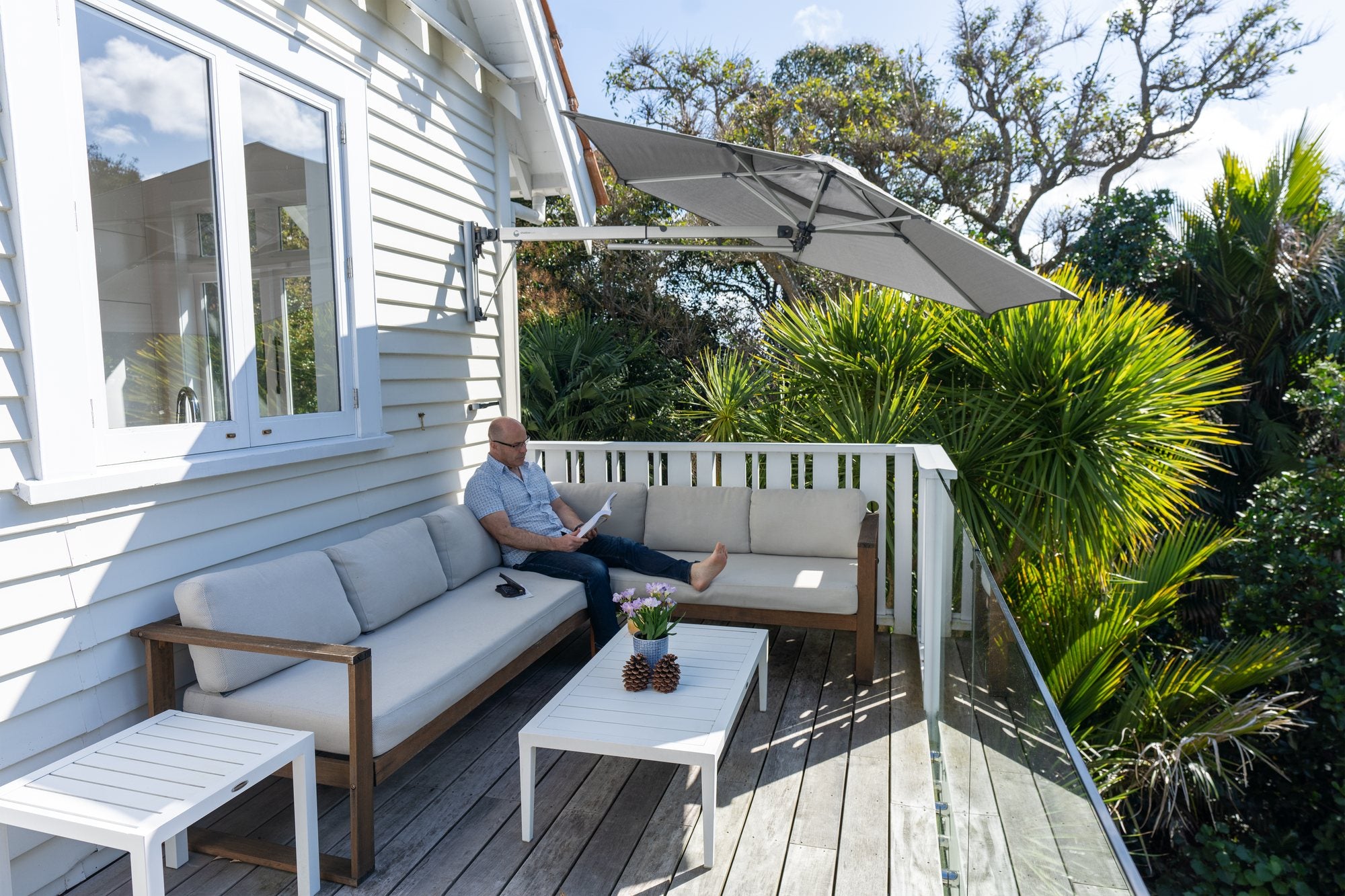Shadowspec Retreat umbrella over an outdoor deck lounge