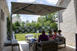 Shadowspec Serenity umbrella over a family patio lounge