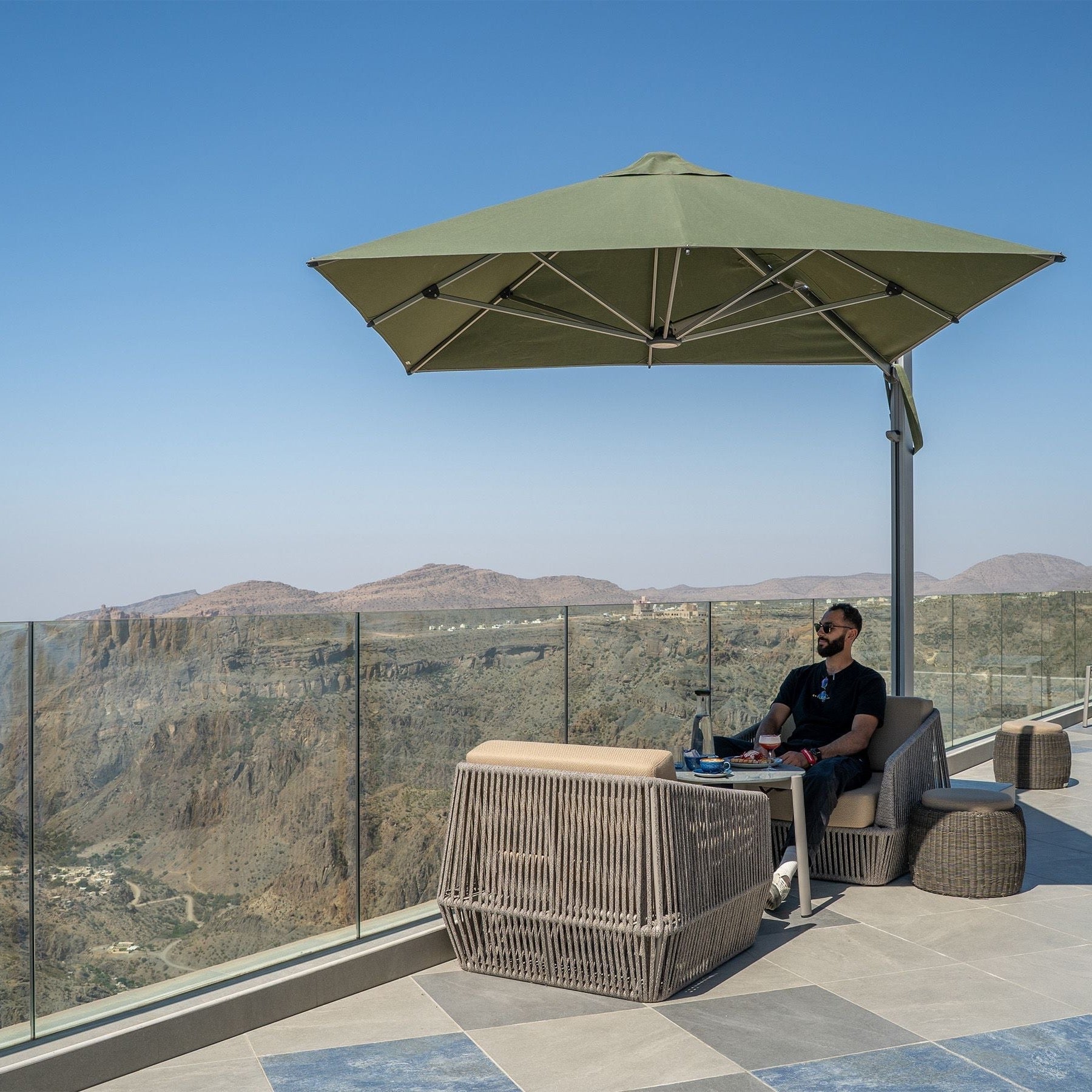 Shadowspec Serenity square-canopy cantilever umbrella over a terrace setting