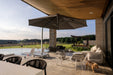 Shadowspec Serenity black canopy over an outdoor terrace setting