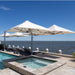 Shadowspec Unity multi-canopy cantilever umbrellas over a waterside deck