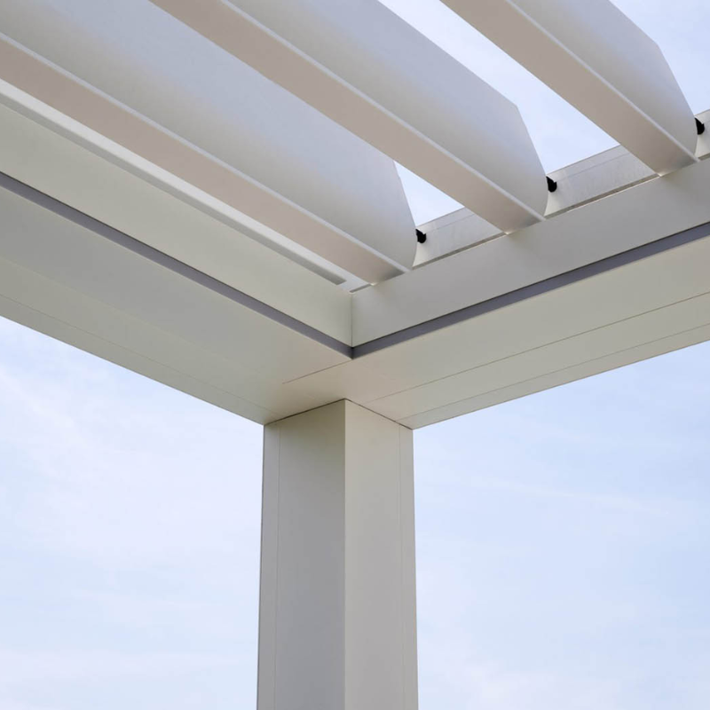 Close-up detail of a white SkyFlex Delta motorised aluminium louvred pergola corner and roof louvres