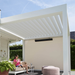 White SkyFlex Delta motorised aluminium louvred pergola shading a modern outdoor lounge patio