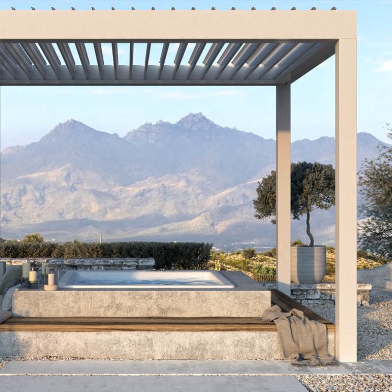 SkyFlex Delta motorised aluminium louvred pergola sheltering an outdoor spa with mountain views