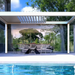 White SkyFlex Delta Open Sky motorised aluminium louvred pergola beside a swimming pool, shading a modern outdoor dining area in front of a glass-walled home