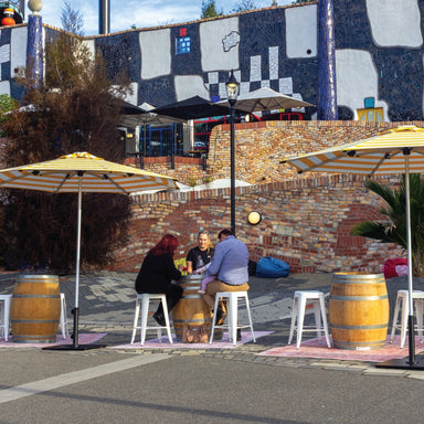Shadowspec Oasis umbrella over an outdoor dining table