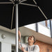 Opening the Shadowspec Oasis umbrella on its spigot and surface plate mount