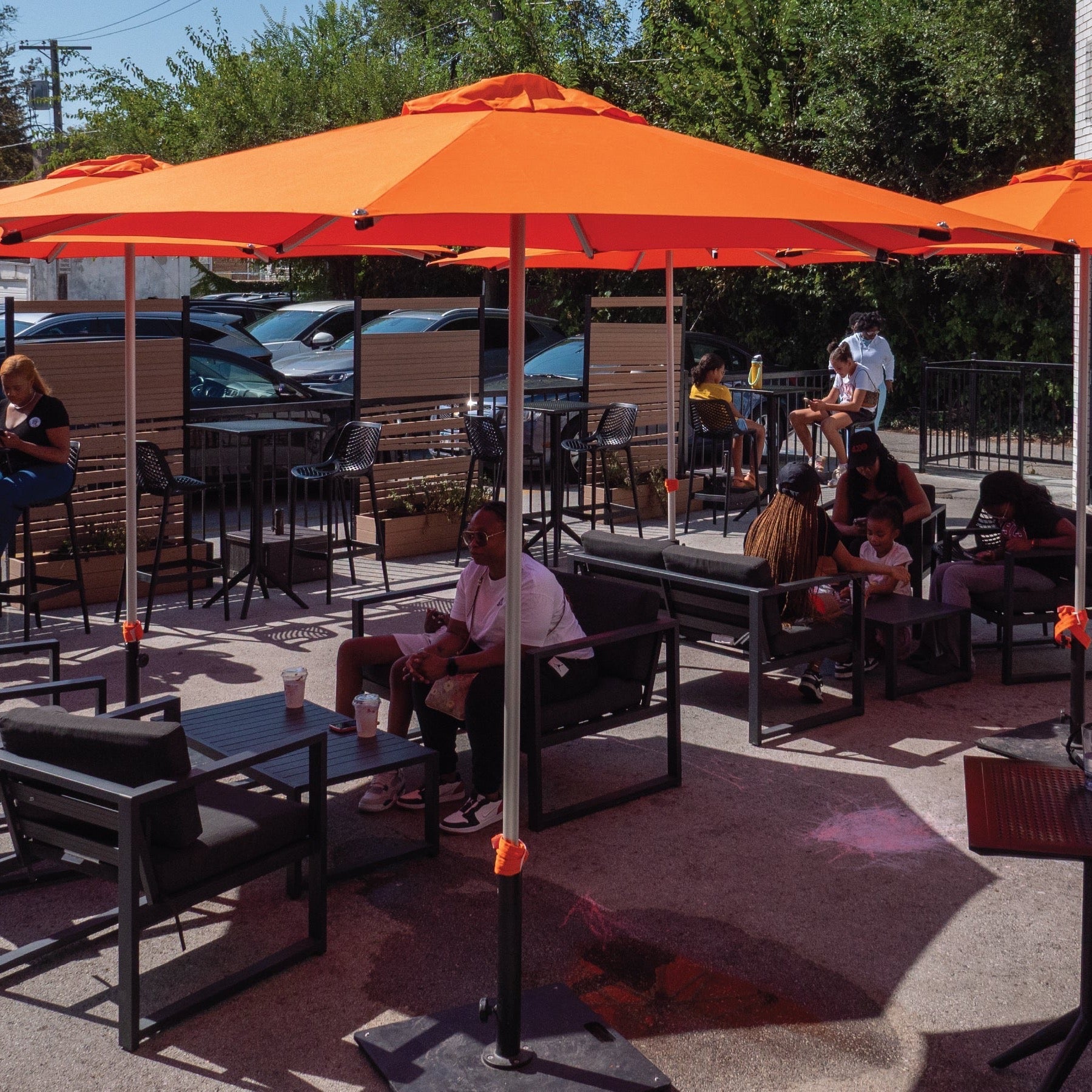 Shadowspec umbrellas in a busy cafe setting