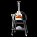 Valoriani BABY oven in Cream on its stand with the fire lit