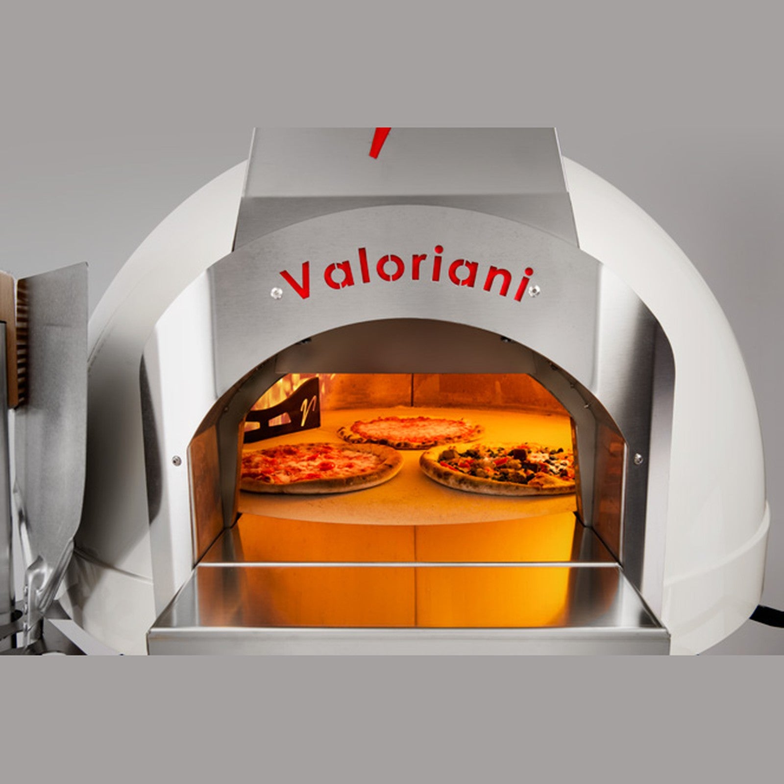 Pizzas cooking on the Cotto clay floor of a Valoriani oven