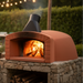 A studio product shot of the white-domed Valoriani Family TOP100 Pizza Oven—highlighting the high-quality refractory clay construction and the classic brick-front design preferred for woodfired ovens.