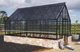 Winter Gardenz Elite 10ft wide glasshouse on a recycled brick base wall, shown with a shade cover fitted